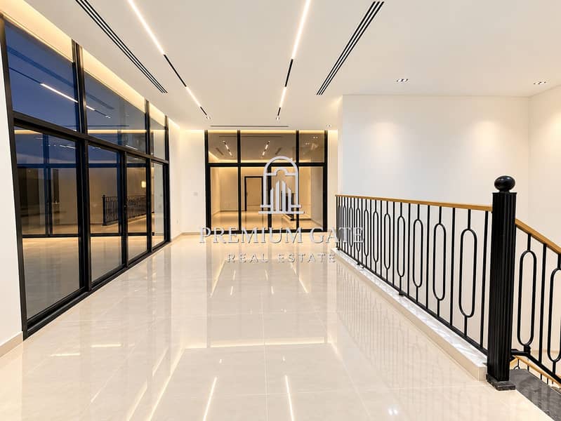 12 Modern Glass-Walled Hallway. png