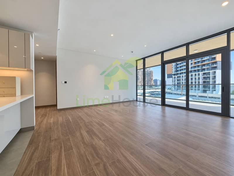 2 02-dubai-sobha-hartland-sobha-waves-opulence-3-bedroom-apartment-living-room-kitchen-03. jpg