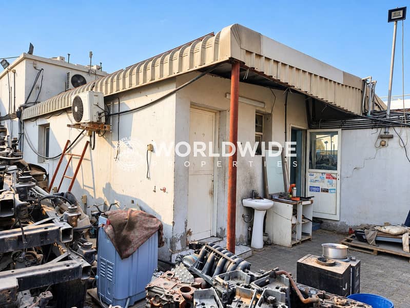 5 Photorealistic sunlit auto salvage yard (4). png