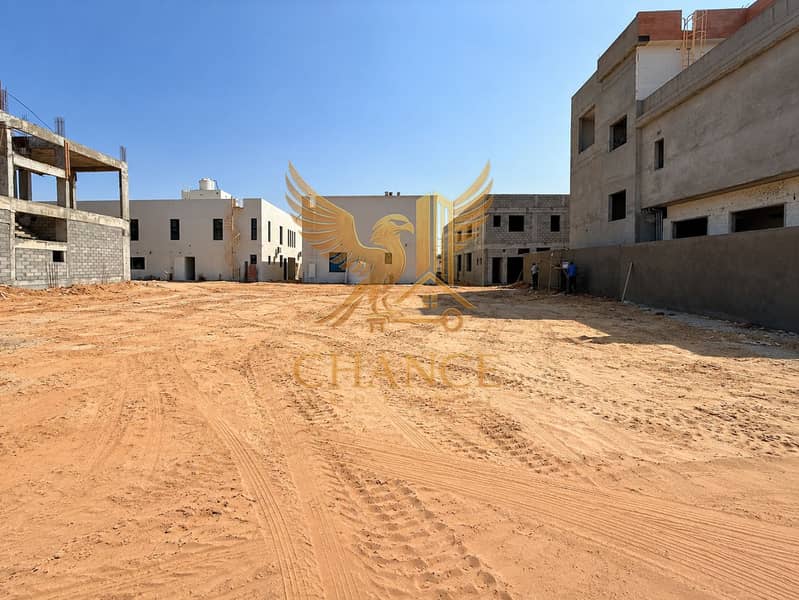 2 Modern Construction Courtyard Under Blue Skies. png