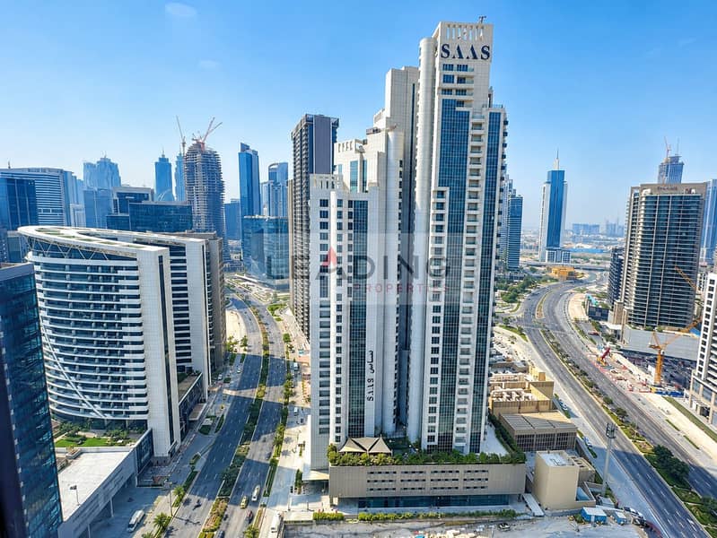 3 SAAS Tower Over the City Skyline. png
