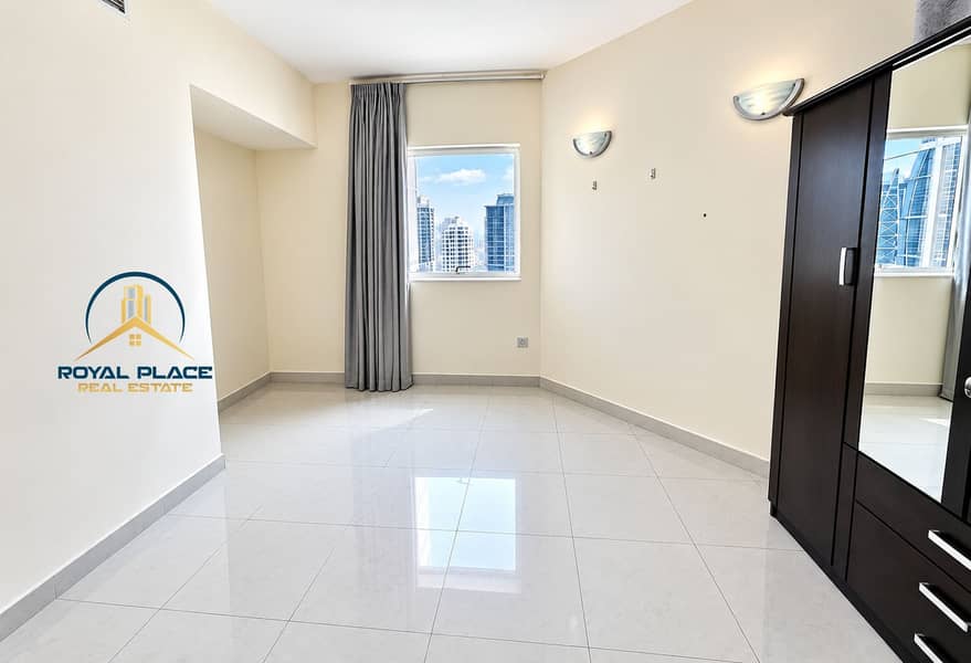 3 Bright Minimalist Bedroom with City View. png