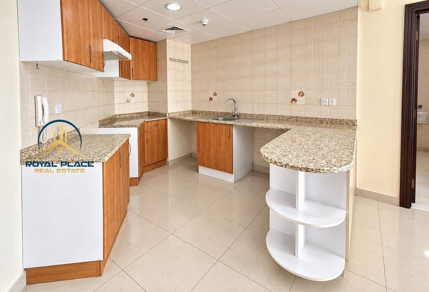 9 Bright Empty Wood-Trimmed Kitchenette. png