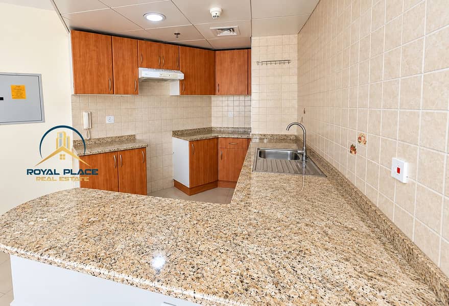 10 Warm Wood Kitchen with Granite Peninsula. png