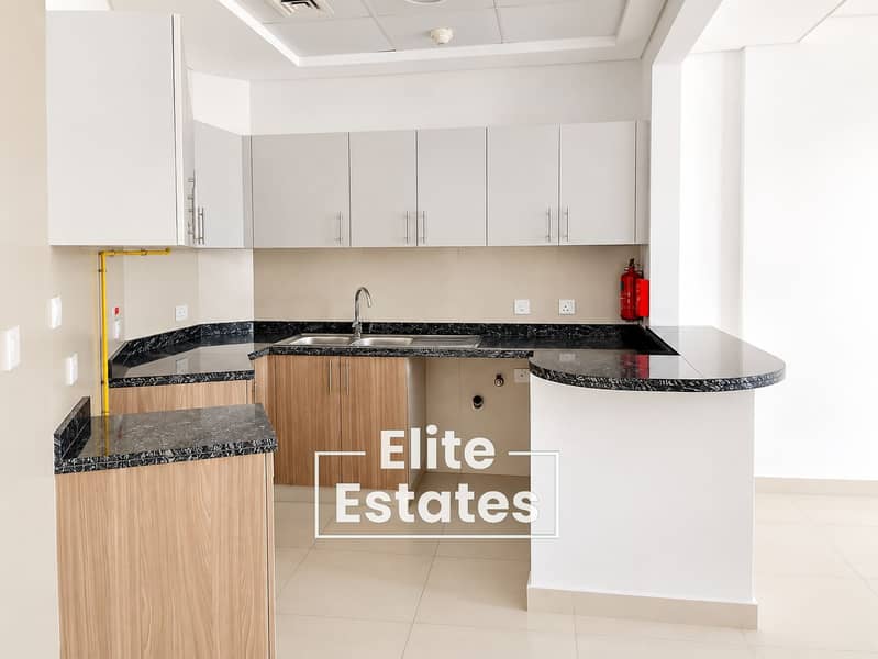 10 Modern Neutral Kitchen with Peninsula. png