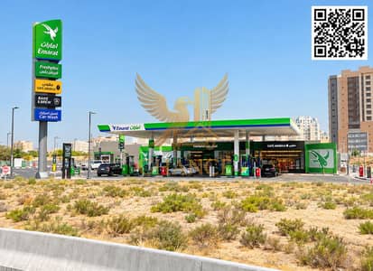 Building for Sale in Al Alia, Ajman - Emarat Station by the Desert Road. png Building for Sale in Al Alia, Ajman - Emarat Station by the Desert Road. png