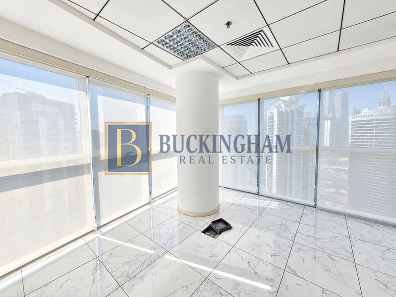 6 Sunlit Empty Corner Office with City Views. png