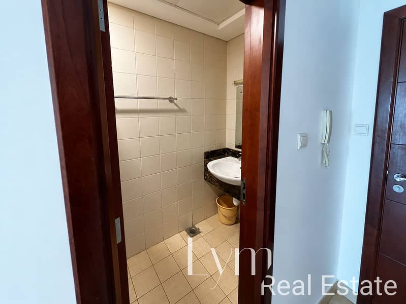 6 Warm Tiled Bathroom Through Doorway. png