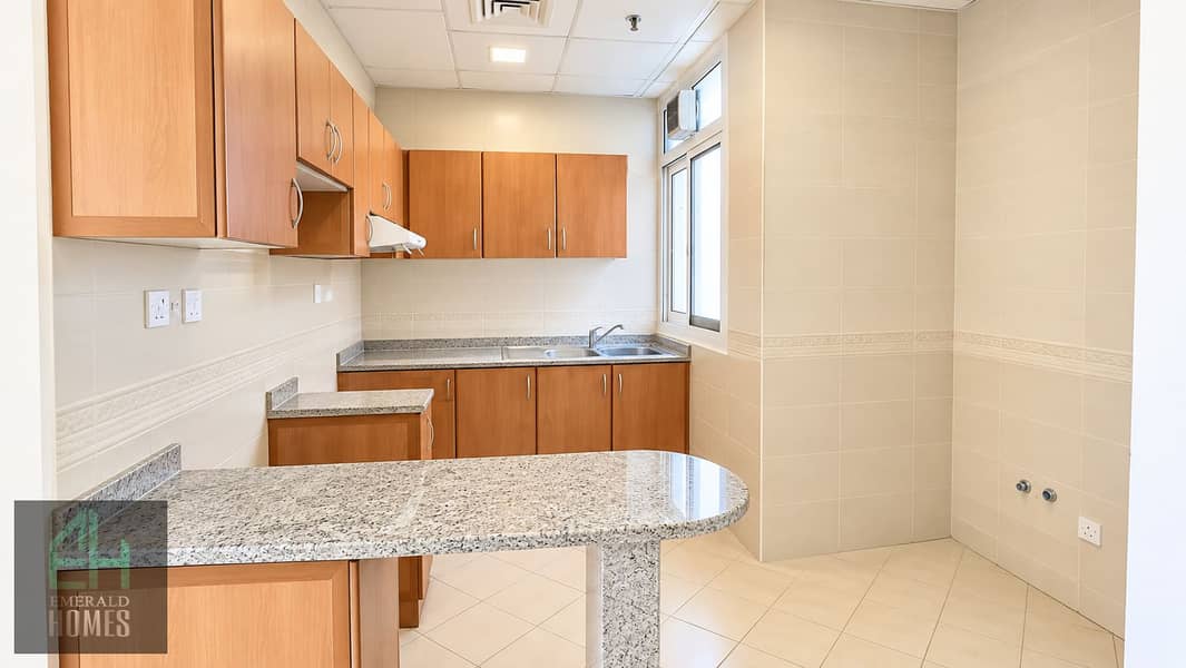 6 Bright Modern Apartment Kitchen. png
