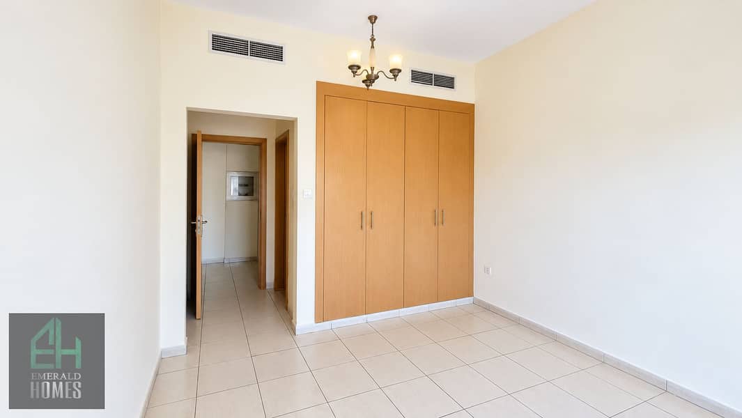 13 Minimalist Empty Room with Wooden Wardrobe. png