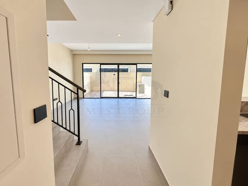 5 Bright Minimalist Living Area with Patio Views. png