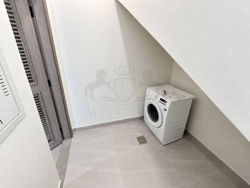 16 Minimalist Under-Stair Laundry Nook. png