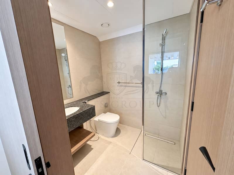 18 Modern Beige-Tiled Bathroom Interior. png