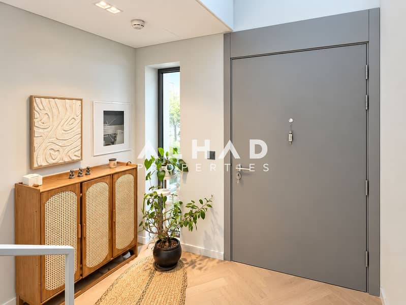 5 Scandinavian Entryway with Gray Door and Plants. png