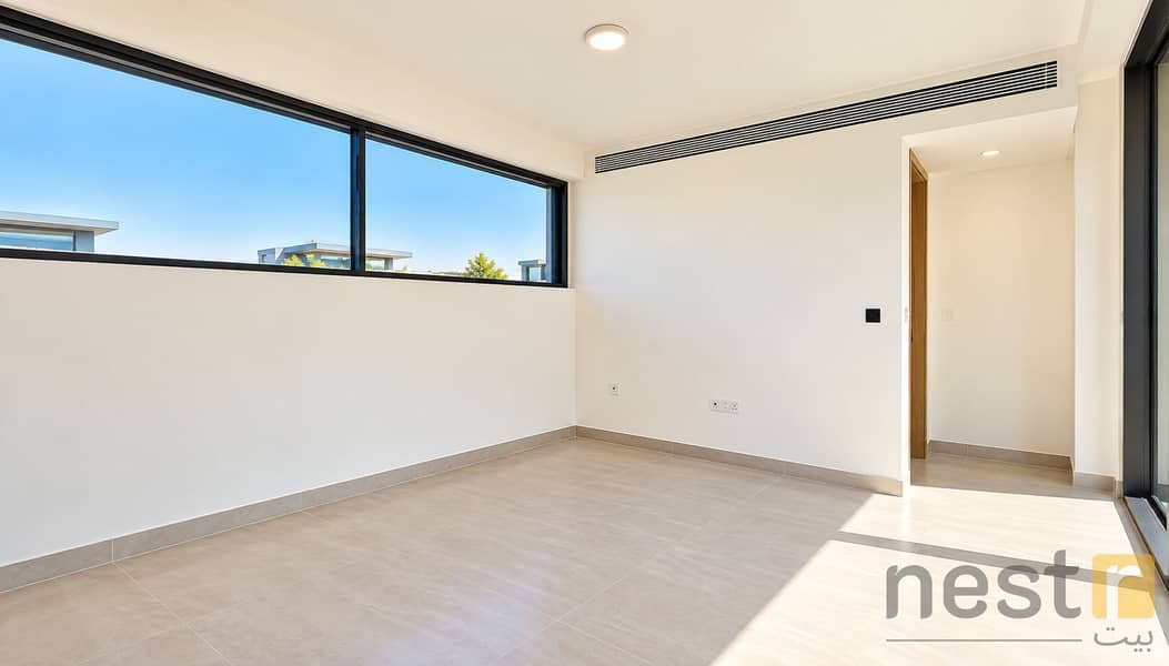 8 Bright Minimalist Room with Sunlit Tiles. png