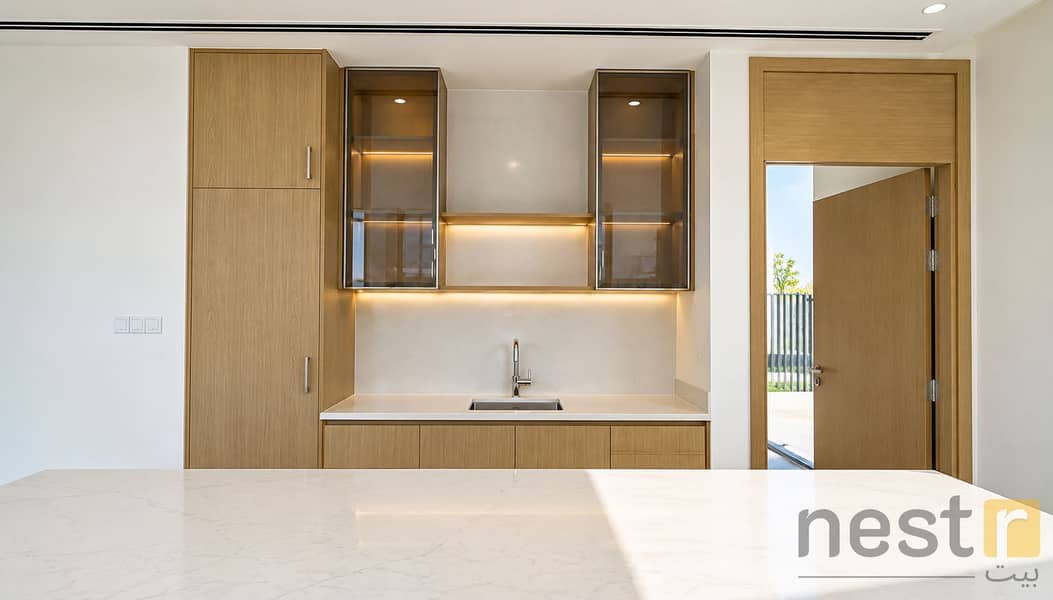 10 Modern Minimalist Kitchen with Warm Wood Accents. png