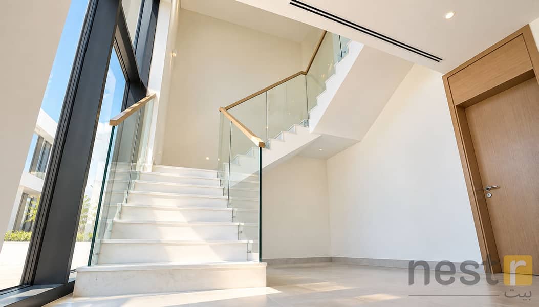 12 Modern Sunlit Glass Staircase Foyer. png