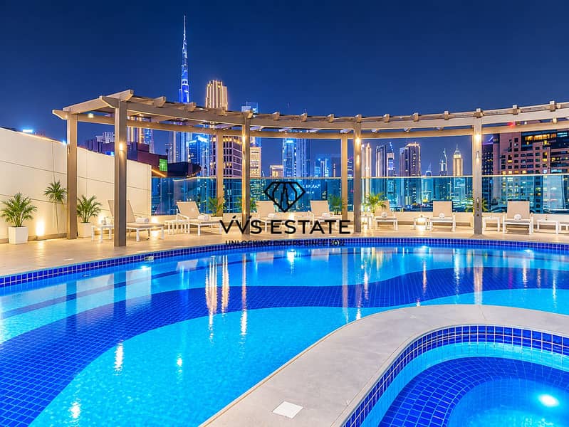 16 Dubai Rooftop Pool Under City Lights. png