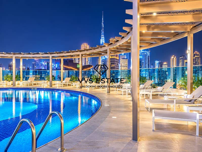 17 Luxury Rooftop Pool Beneath City Lights. png