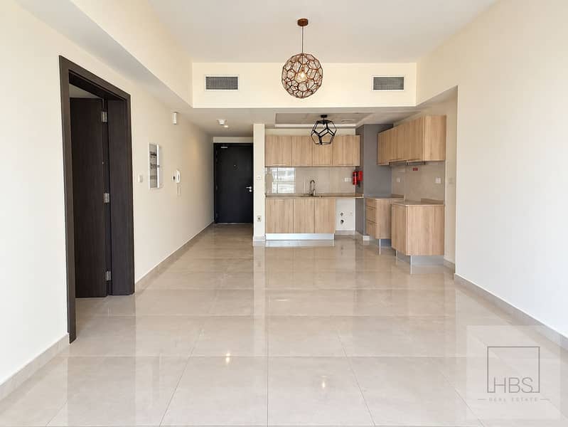 4 Bright Modern Apartment Interior with Compact Kitchen. png