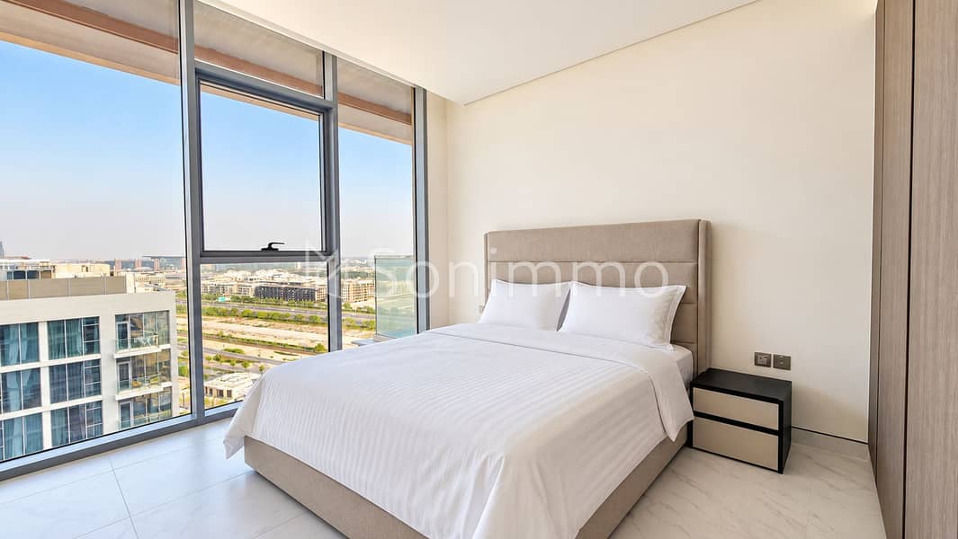 11 Sunlit Modern Bedroom with City Views. png