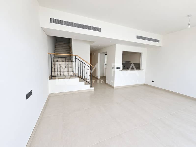 2 Bright empty living room with ornate staircase-6