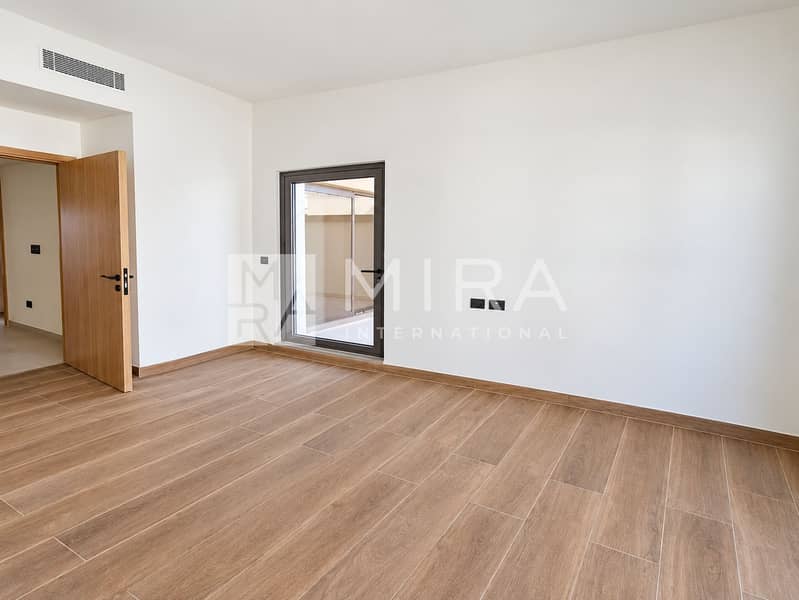 12 Bright neutral bedroom with balcony access-10