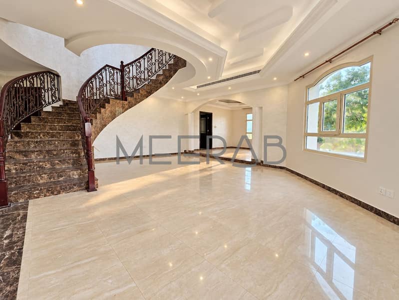 2 Elegant Curved Staircase Foyer. png
