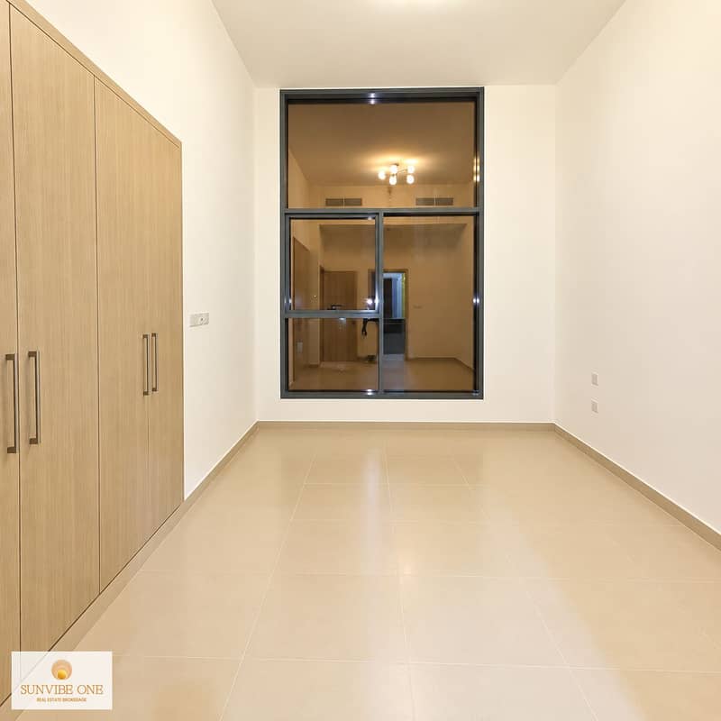 3 Warm Minimalist Room with Window and Wardrobe. png