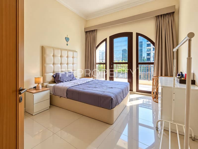 4 Sunlit Modern Bedroom with Balcony Views. png