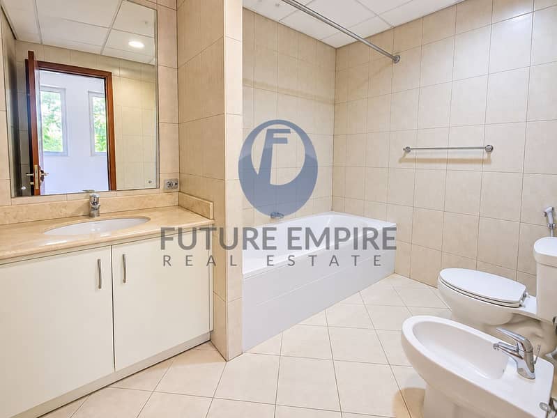 16 Bright Modern Beige-Tiled Bathroom. png