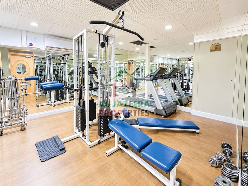 7 Bright Mirrored Gym Equipment Interior. png