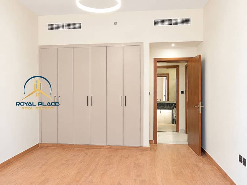 9 Minimalist Bedroom with Wardrobe and Open Door. png