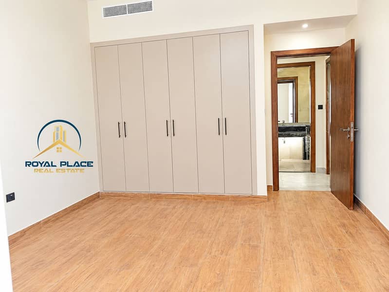 10 Minimalist Bedroom with Built-In Wardrobes and Bathroom Alcove. png