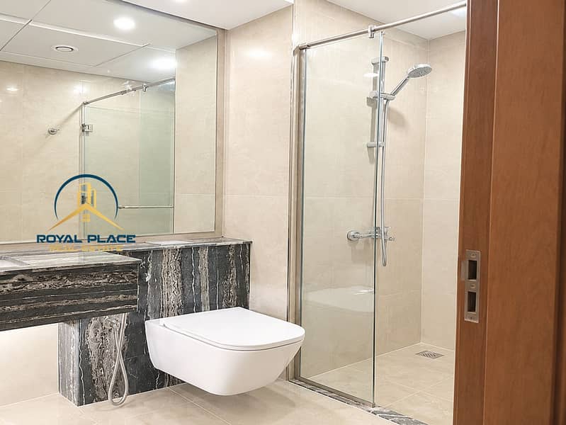 16 Modern Marble Bathroom with Glass Shower. png