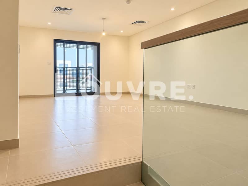 11 Bright Minimalist Room with Glass Stair Railing. png