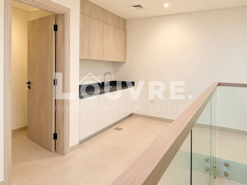 12 Minimalist Hallway Wet Bar with Glass Railing. png