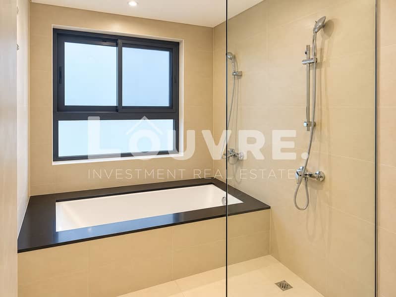 19 Modern Beige Bathroom with Tub and Shower. png