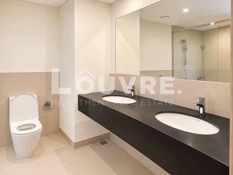 22 Modern Beige Bathroom with Double Vanity. png