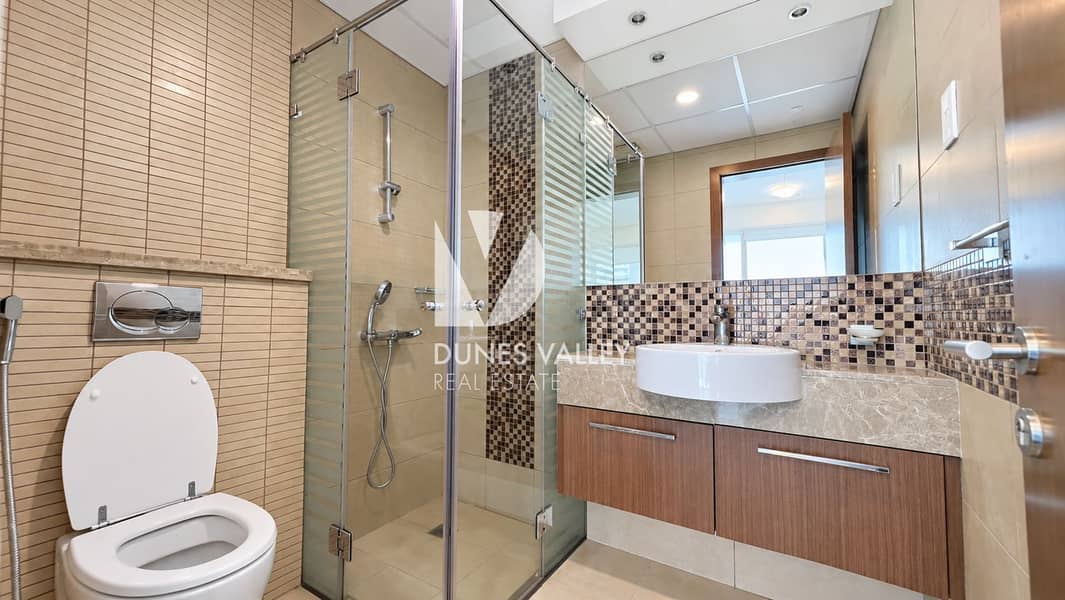 6 Modern Beige-Tiled Bathroom Retreat. png