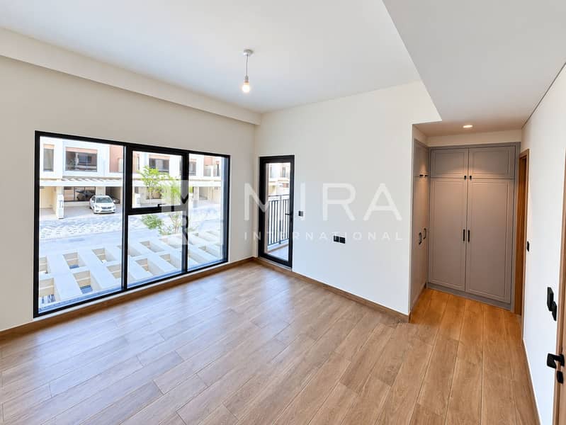 4 Brightened bedroom, balcony door and street view-4