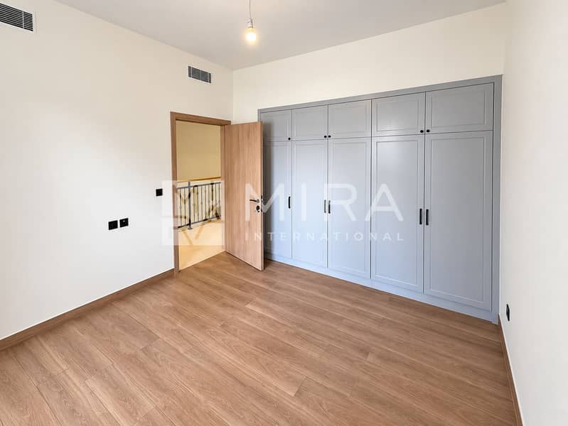 7 Bright bedroom, gray wardrobes, open door-3