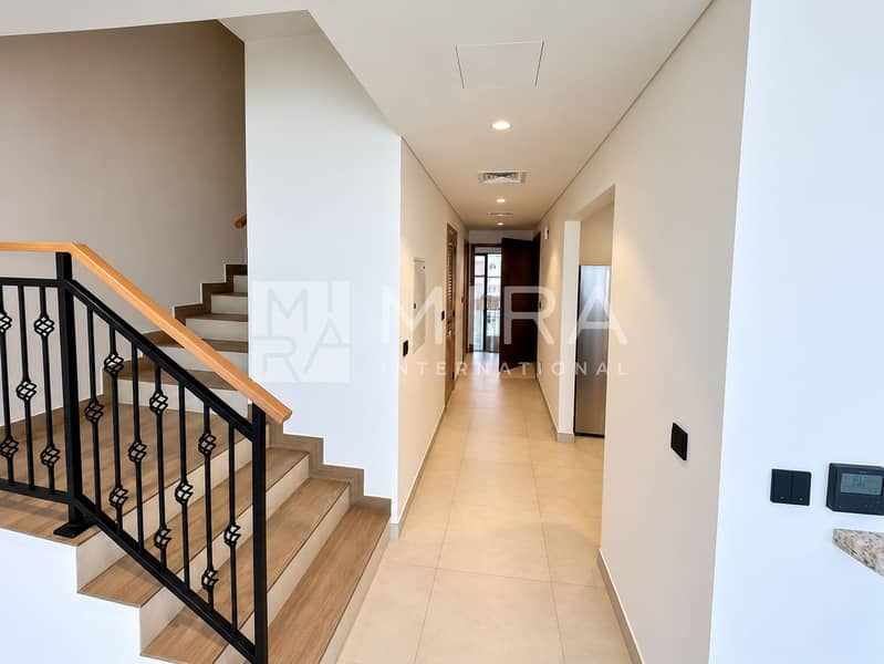 20 Brightened Corridor With Ornate Staircase-10