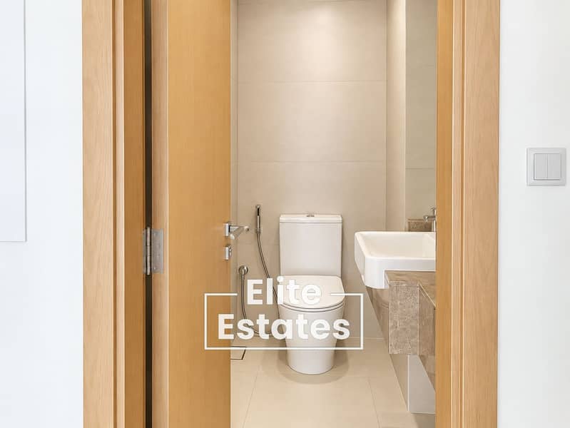 11 Minimalist Beige Bathroom Interior. png