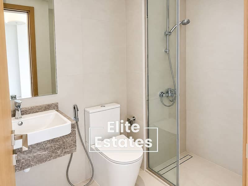12 Minimalist Beige-Tiled Modern Bathroom. png