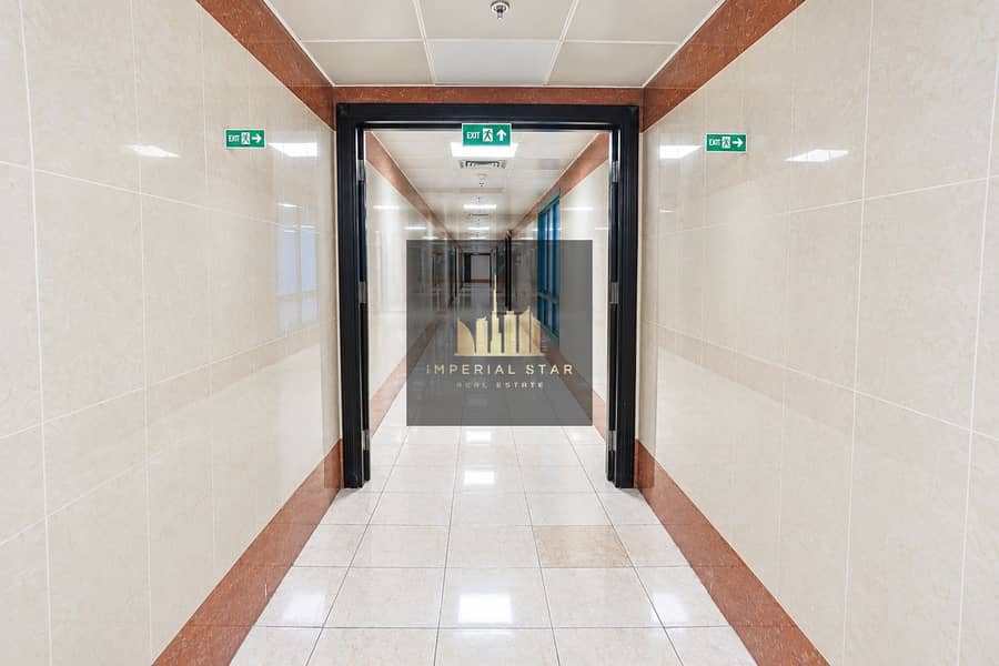5 Symmetrical Marble-Tiled Exit Corridor. png