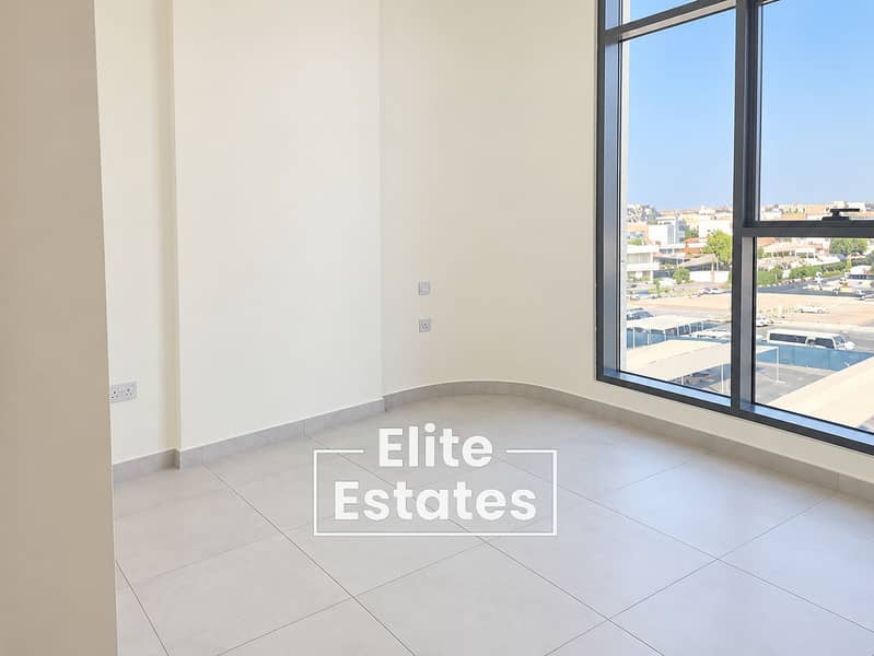 6 Bright Minimalist Room with Urban Window View. png