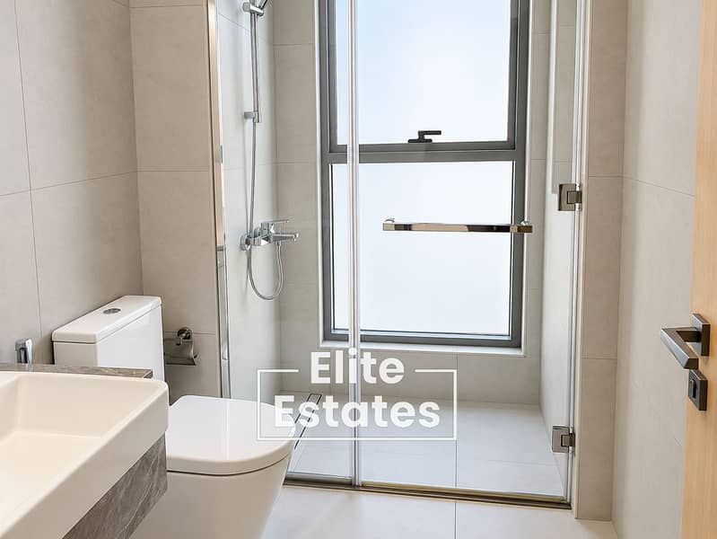 15 Modern Minimalist Bathroom with Glass Shower. png