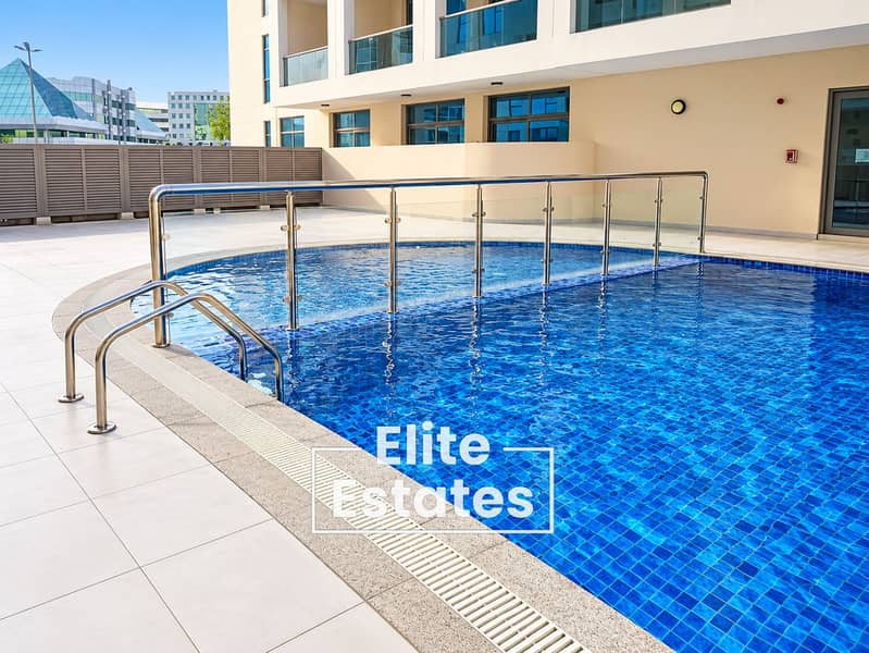 23 Sunlit Modern Rooftop Pool Courtyard. png