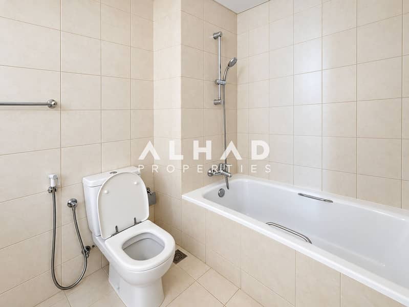 6 Clean Modern Beige-Tiled Bathroom. png